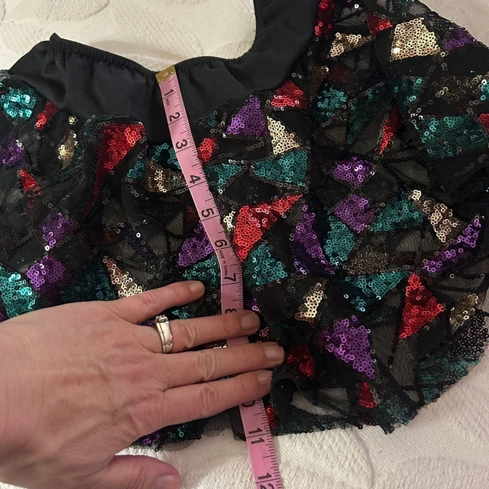 Like new XL girl’s 3 piece dance costume. Halter  leotard with  short & 2 skirts